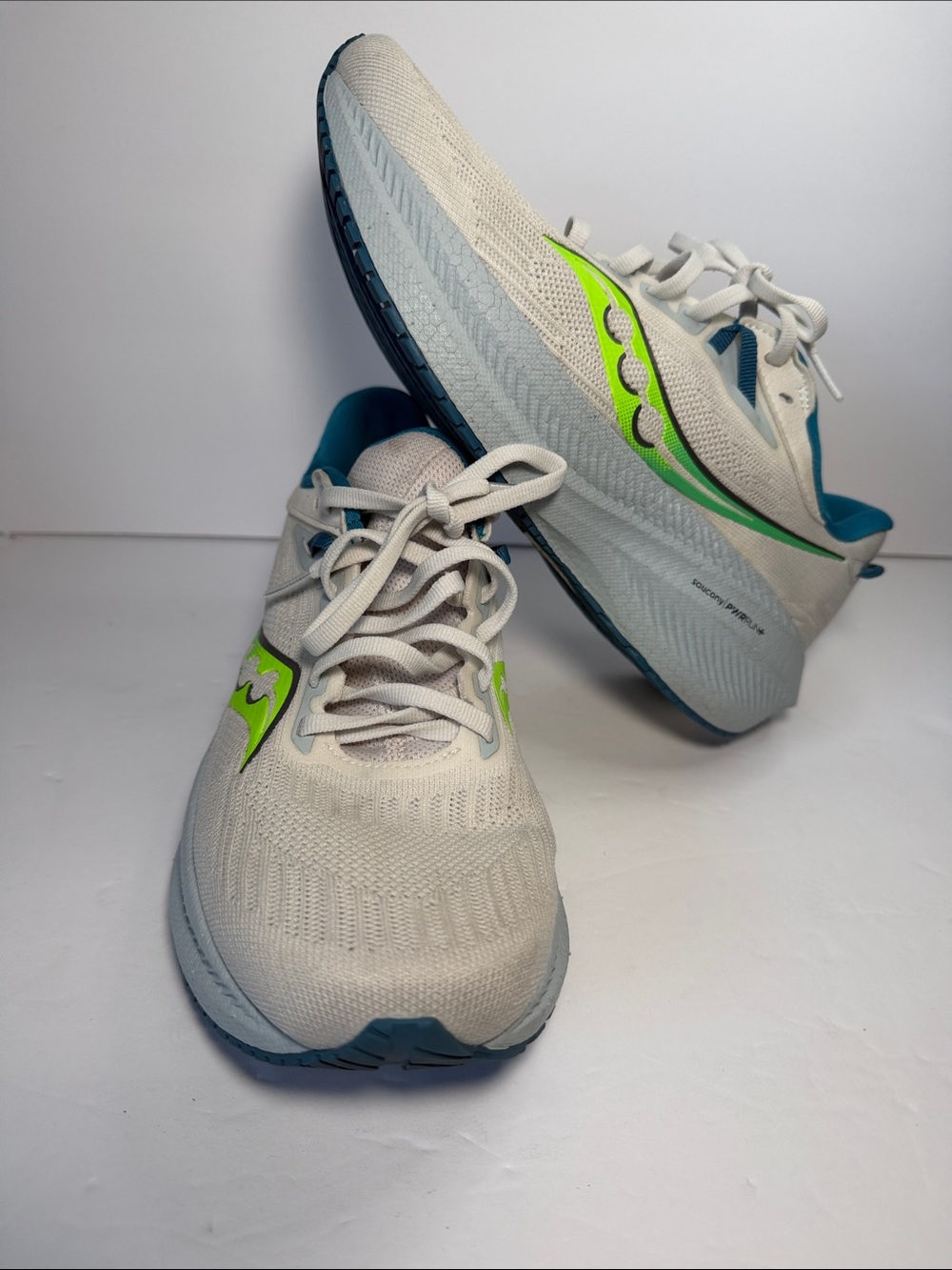 Saucony White Running Shoes with Neon Green and Teal Accents - Picture 2 of 9